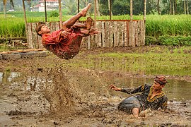 Silek Lanyah 2020 - Two men performing martial art in a stream.jpg