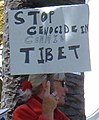 "STOP GENOCIDE IN COMMIE TIBET" sign detail, 2008 Olympic Torch Relay in SF - Embarcadero 02 (cropped).JPG