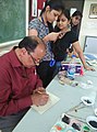 Artist gopal prasad sharma teaching students .jpg