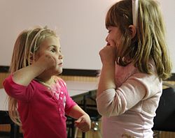 Girls learning sign language.jpg