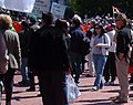 "FREE TIBET" signs and Tibetan Flag at San Fransisco protest, from- 2008 Olympic Torch Relay in SF - Dragon dance 02 (cropped).JPG